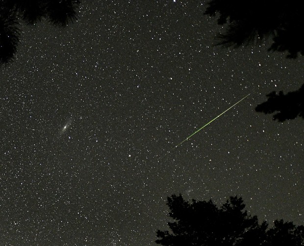A Perseid meteor seen near the Andromeda Galaxy (the bright smudge on the left of the image, Rocky Mountain National Park, Colorado, US, 12 August 2018. Credit: STAN HONDA/AFP via Getty Images