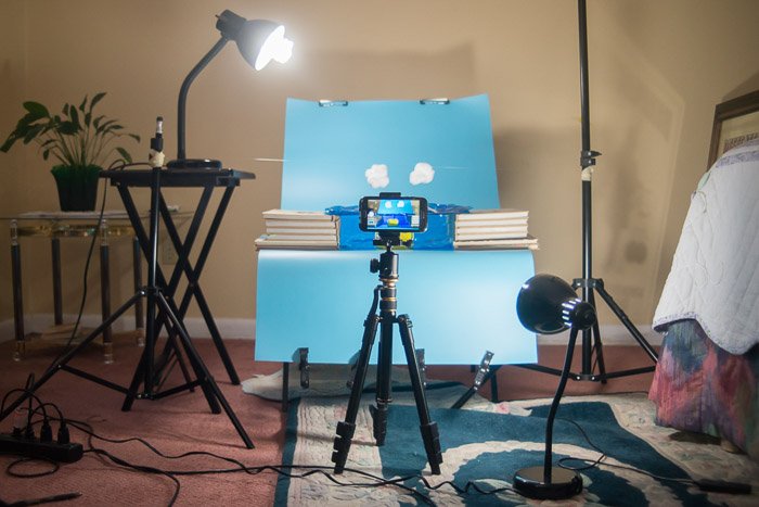 A phone set up on a tripod to shoot smartphone product photography