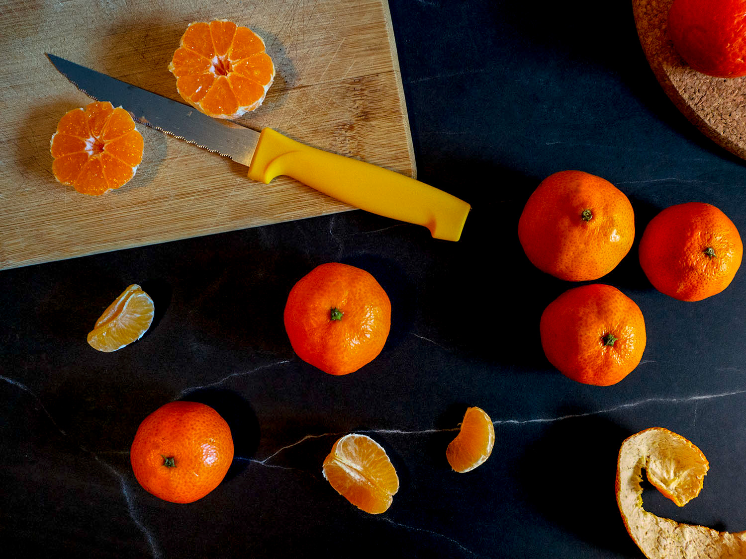 oranges and a knife on a table